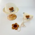 Detail of baby straw sun hat and matching bear crossbody bag set with plush bear decor - Hat And Bag Set / Cream