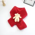 Detailed close-up of a soft red plush scarf featuring a cute cream-colored teddy bear mascot - 10*75cm / Red
