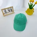 Close-up of mint green cotton baseball cap with detailed stitching and breathable eyelets - 2-8 Years / Cyan