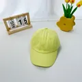 Detailed view of yellow cotton baseball cap with reinforced brim and uniform stitching - 2-8 Years / Goose Yellow