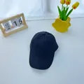 Close-up of a classic black cotton baseball cap on a stylish tabletop background - 2-8 Years / Black