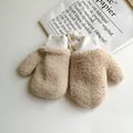 Detailed view of beige lamb wool mittens with white ribbed cuffs and a hanging neck string - M / Khaki
