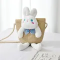 Detail of a handmade straw bag with a cute white plush rabbit and thick woven shoulder strap - Beige Bag White Rabbit