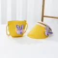 Detail of yellow straw sun hat and matching crossbody bag with purple smile bow - 48-52cm / Single Hat / Yellow - Purple Rabbit
