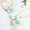 Detail of white woven straw girls bag featuring blue sequined mermaid tail and pearls - Small Bag / Creamy White (Mermaid Series)
