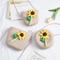 Detail of girls straw crossbody bags with sunflower ornaments on a bright background - Small Square Bag / Pink - One Large Sunflower