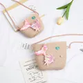 Detail of straw woven mermaid crossbody bag with shell and pearl decorations - Small Bag / Pink (Mermaid Series)