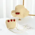 Close-up of girls' straw sun hat and matching crossbody bag with 3D strawberry charms - S(52cm) / Kids Hat / Beige