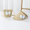 Détail de l'ensemble chapeau de paille et sac pour enfant avec papillon pailleté brillant - Beige - Papillon Blanc À Paillettes