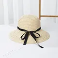 Elegant beige straw hat with black ribbon bow and wide brim for summer sun protection - Black Bow / Beige