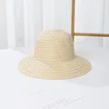 Women's woven sun hat in beige straw with black ribbon bow for outdoor sun protection - Plain / Beige