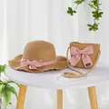 Detail of straw hat and crossbody bag with pink bow and Hand Made woven label - S Kids Size / Lotus Leaf Hat and Bag Set / Khaki