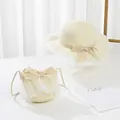 Detail of girls straw sun hat and matching lace crossbody bag in creamy white color - Kids (52cm Hat Only) / Cream White (Ruffle)