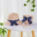 Detail of straw hat and crossbody bag set with blue ribbon bows and hand made labels - S Kids Size / Wide Brim Hat and Bag Set / Pink