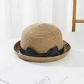 Detailed shot of kids straw hat featuring a chic black ribbon bow and woven texture - Kids / Khaki
