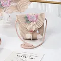 Detail of child straw crossbody bag with pink butterfly embroidery and floral tassel charm - Butterfly Bead Flower / 15*13cm / Pink
