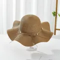 Elegant wide-brim straw sun hat with wavy edge and pearl bow detail for women's beach holiday - M / Khaki