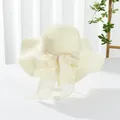 Detail of a creamy wide-brim sun hat with wavy edges and a large sheer mesh bow decoration - M (Adult) / Wave Edge Style / Wavy Edge Milky White