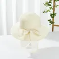 Close-up of beige woven sun hat with a large bow and natural texture detail - M (Adult) / Large Brim Style / Large Brim Milky White