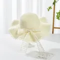 Close-up of cream straw hat featuring detailed lace ribbon with floral embroidery - S Kids / Grid Bow Ribbon (Ruffled Edge) / Cream