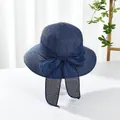 Close-up of navy blue straw sun hat featuring a large elegant mesh bow detail - M (Adult) / Large Brim Style / Large Brim Navy Blue