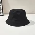 Classic black cotton bucket hat with a wide brim and detailed stitching for sun protection - One Size / Black