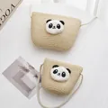 Detail of woven straw panda bags in two sizes with soft cotton rope shoulder straps - Small Bag / Beige