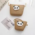 Detailed close-up of handmade woven panda crossbody bags on a minimalist white surface - Small Bag / Khaki