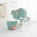 Detail of mint green straw hat and bag set with lace butterflies and pearl accents - Kids Style (Size 52) / Green