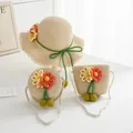 Detail of summer straw hat and matching bags with handmade floral knit decorations - Beige Yellow Orange Flower (Kids Size)