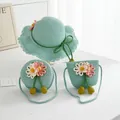 Detail of mint green woven straw hat and matching bags with daisy flower decorations - Green Spider Lily Decoration (Kids Size)