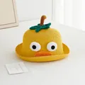 Detail of yellow woven straw hat with cartoon big eyes and green leaf for kids summer sun protection - 50-52CM / Yellow