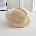 Close-up of beige straw boater hat with ribbon trim on white textured surface - M Adult (56-58cm) / Beige with Beige Edge