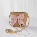 Kids woven straw crossbody bag in natural color with a large pink bow decoration - Single Bag / Khaki