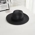 Close-up detail of woven texture and black decorative ribbon on summer straw jazz hat - M / Black Ribbon - Black