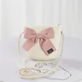 Children's cream straw crossbody bag with large pink bow and handmade label details - Single Bag / Cream