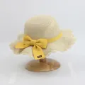 Beige woven straw sun hat for girls with yellow ribbon bow and wavy brim edge - S Kids Size / Lotus Leaf Single Hat / Beige