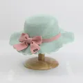 Mint green woven straw sun hat for girls with a pink bow and wavy brim edge - S Kids Size / Lotus Leaf Single Hat / Green