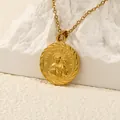 Macro shot of gold San Judas Tadeo medal pendant on white rock base with detailed wheat border - Gold
