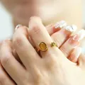 Vintage gold open ring featuring oval cat eye stone and textured metal clusters - Golden Dark Yellow Cat Eye Stone