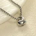 Polished silver heart-shaped cremation urn necklace with elegant box chain on a sandy base - Steel Color Pendant Only (Without Chain)