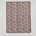 Brown Nordic knit blanket with white leaf vein patterns and decorative stitched edges - Brown