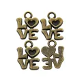 Detail of four vintage bronze LOVE charms with heart motifs for DIY jewelry making - Antique Bronze