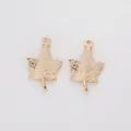 Macro detail of golden maple leaf charms showing intricate vein textures and metal finish - KC Gold