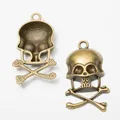 Vintage bronze skull and crossbones metal charm pendants with round hanging loops - Antique Bronze