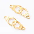 Detailed macro view of gold-plated handcuff charms with Freedom engraving for DIY jewelry - 30x10mm / Gold