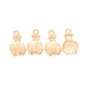 Macro shot of gold money bag charms with dollar sign for DIY jewelry making - KC Gold