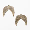 DIY vintage bronze alloy angel wing charms with detailed feather texture in a pair - Antique Bronze