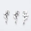 Macro detail of three vintage silver angel wing charms for DIY jewelry making crafts - Antique Silver
