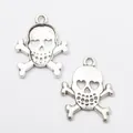 Vintage silver skull crossbone charms with heart shaped eyes and hanging rings - Antique Silver